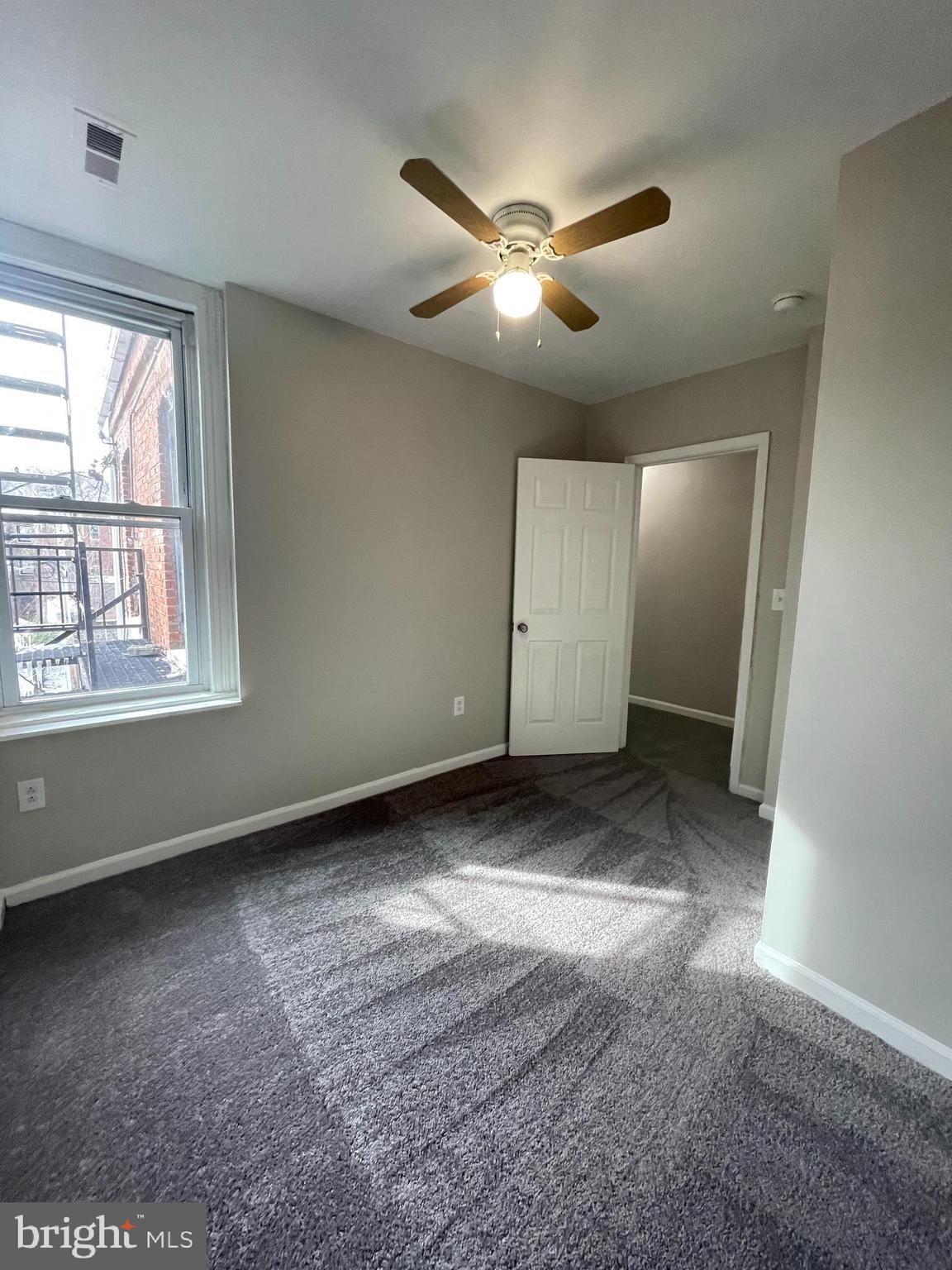 1426 McCulloh Street, Unit 2 Baltimore, MD 21217 - Photo 8 of 25 a view of a livingroom with a ceiling fan and window