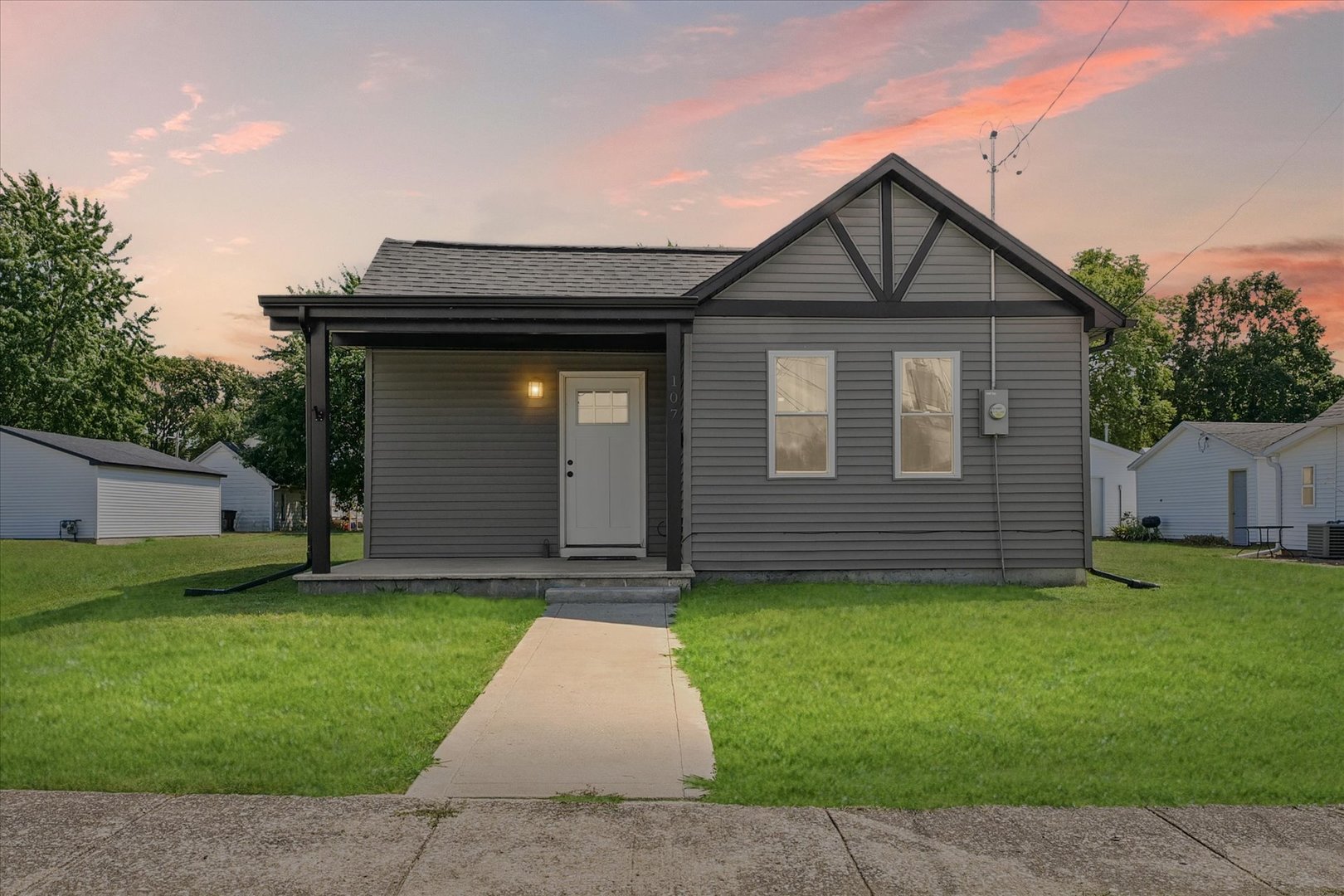a front view of a house with a yard