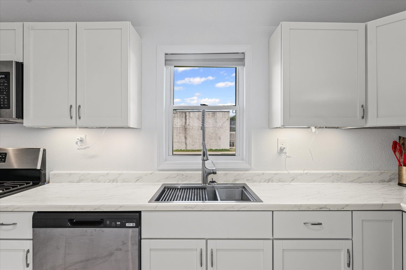 107 Front Street Fisher, IL 61843 - Photo 11 of 25 a kitchen with a sink cabinets and window