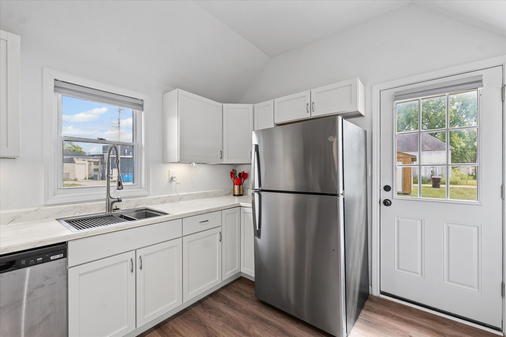 107 Front Street Fisher, IL 61843 - Photo 12 of 25 a white refrigerator freezer sitting inside of a kitchen