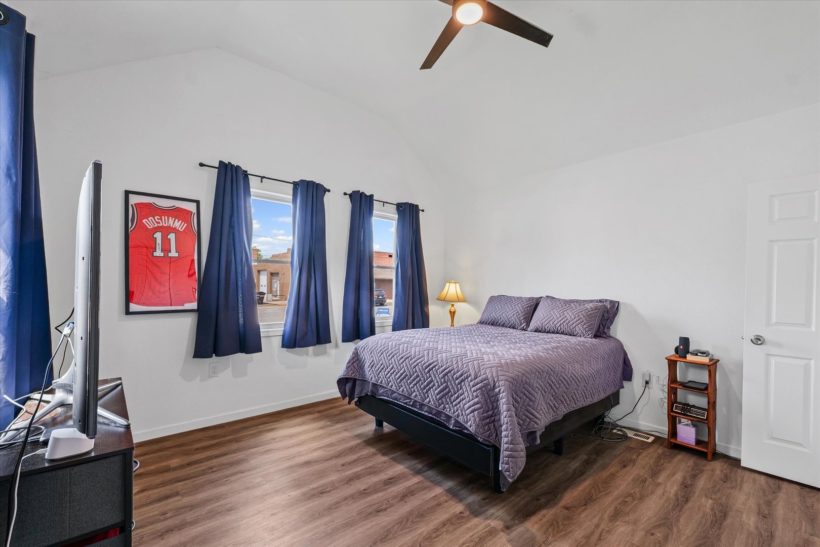 107 Front Street Fisher, IL 61843 - Photo 14 of 25 a bedroom with a bed and wooden floor