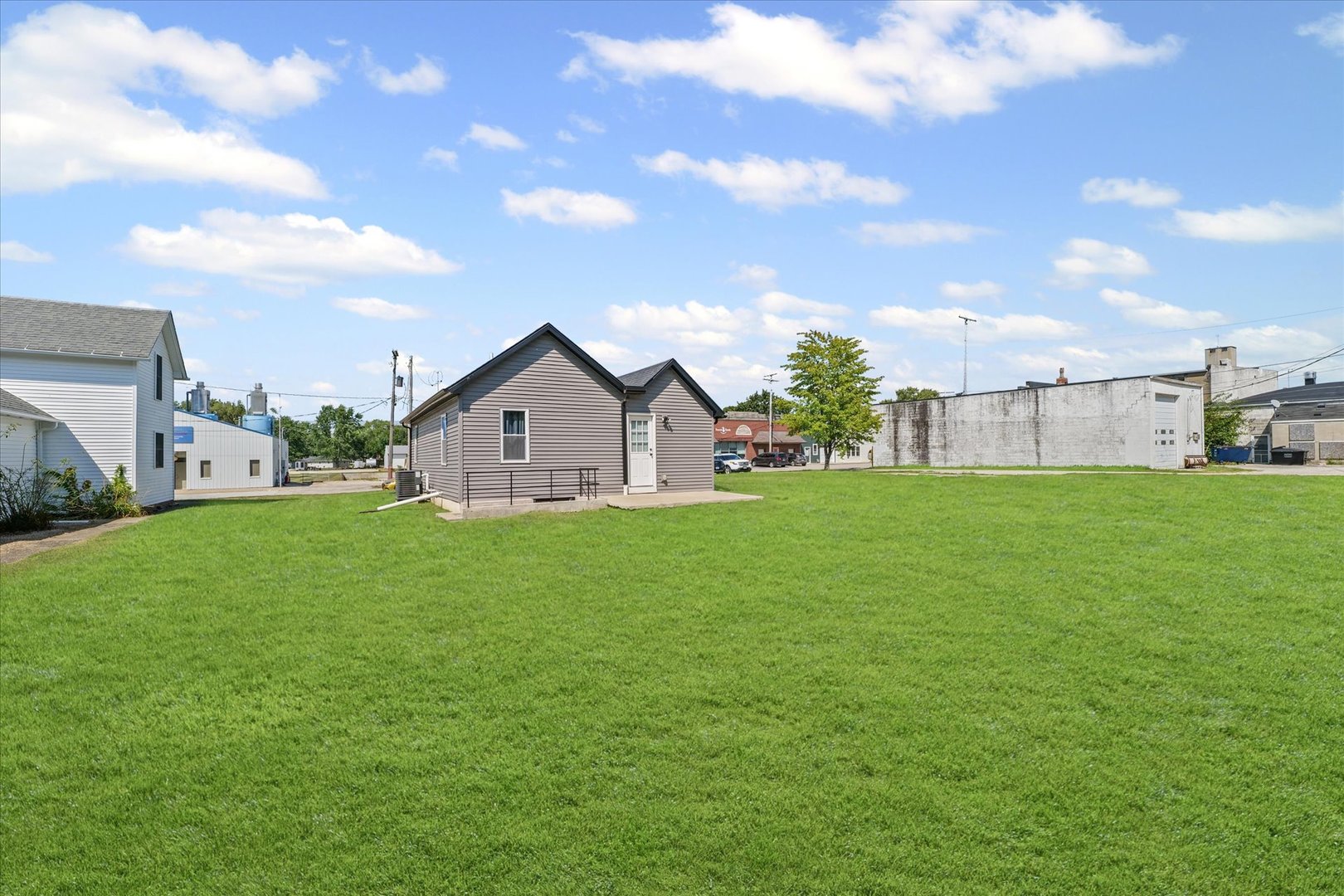 107 Front Street Fisher, IL 61843 - Photo 20 of 25 a view of a house with a yard