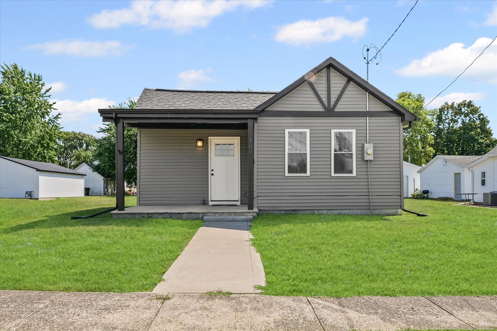 107 Front Street Fisher, IL 61843 - Photo 2 of 25 a view of a house with a yard