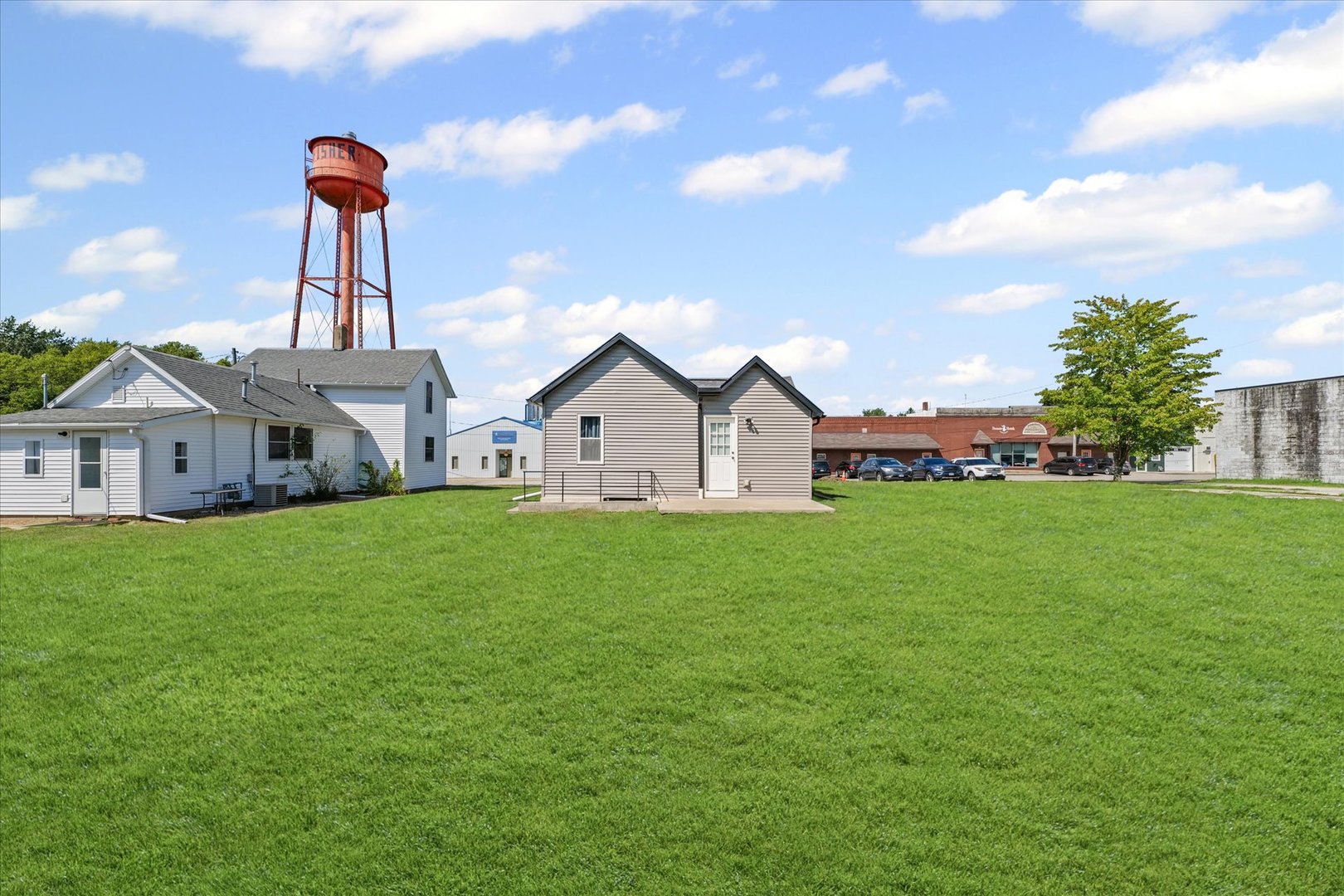 107 Front Street Fisher, IL 61843 - Photo 21 of 25 a front view of a house with garden