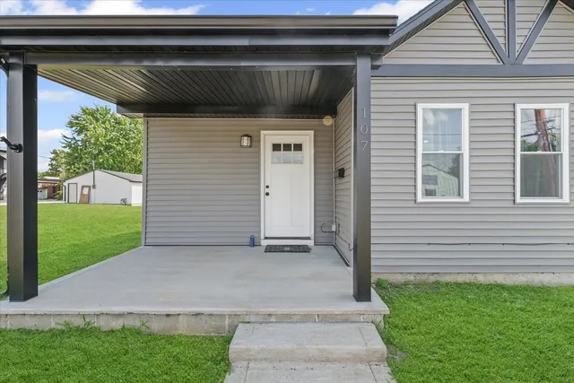 a view of backyard with a barn and a cactus plant