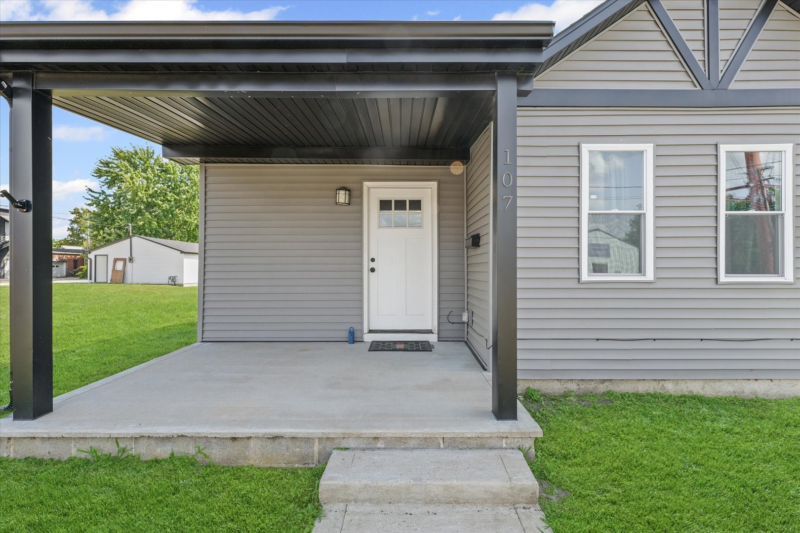 107 Front Street Fisher, IL 61843 - Photo 4 of 25 a view of backyard with a barn and a cactus plant