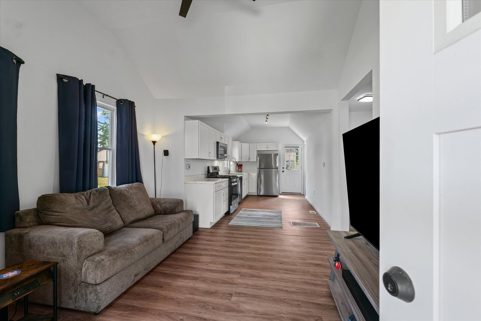 107 Front Street Fisher, IL 61843 - Photo 5 of 25 a living room with furniture and a flat screen tv