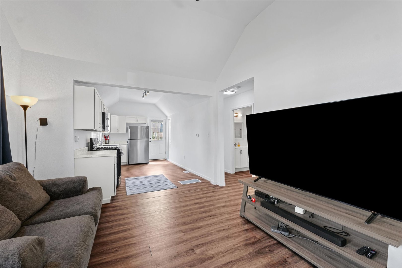 107 Front Street Fisher, IL 61843 - Photo 6 of 25 a living room with furniture and a flat screen tv