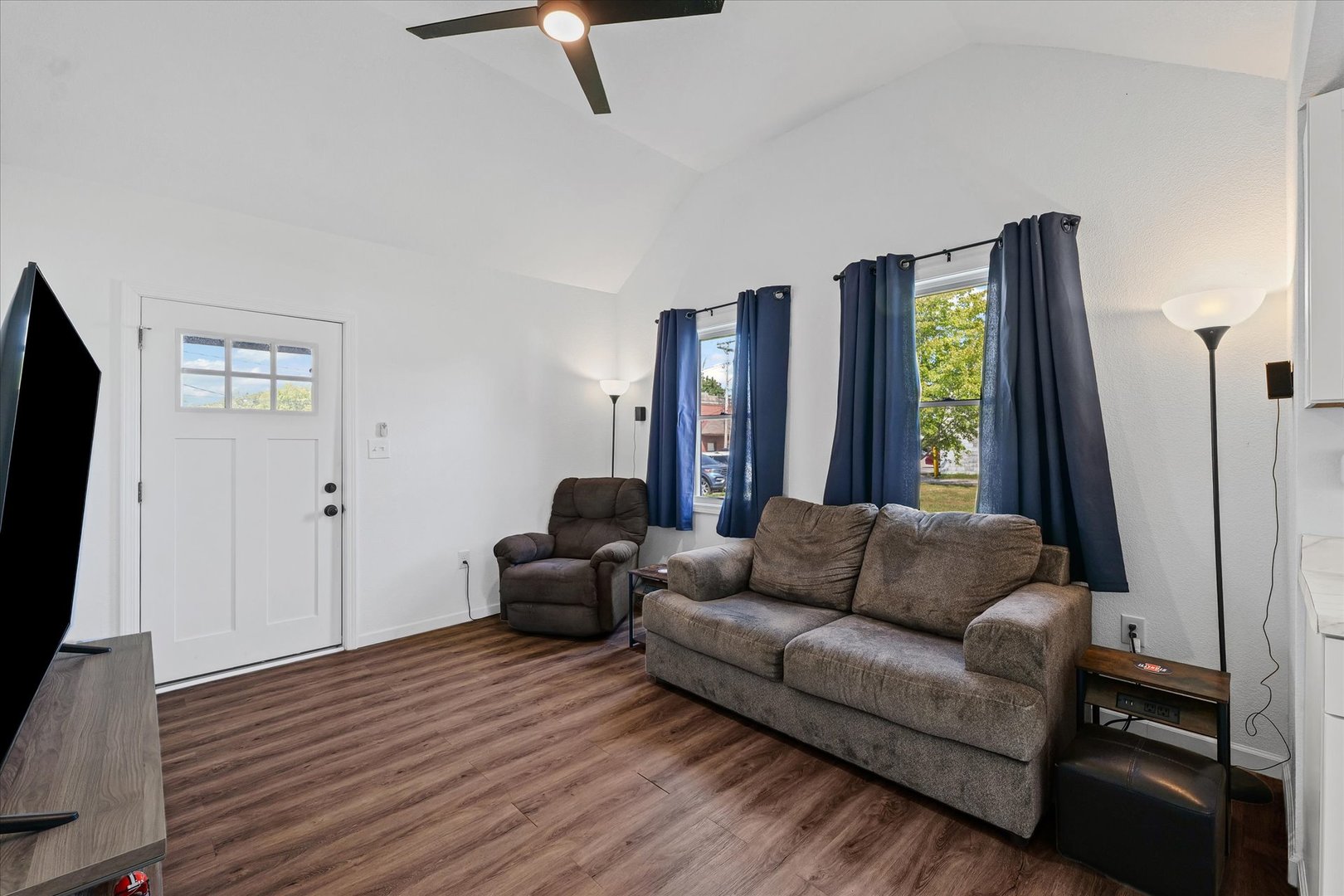 107 Front Street Fisher, IL 61843 - Photo 7 of 25 a living room with furniture and a flat screen tv