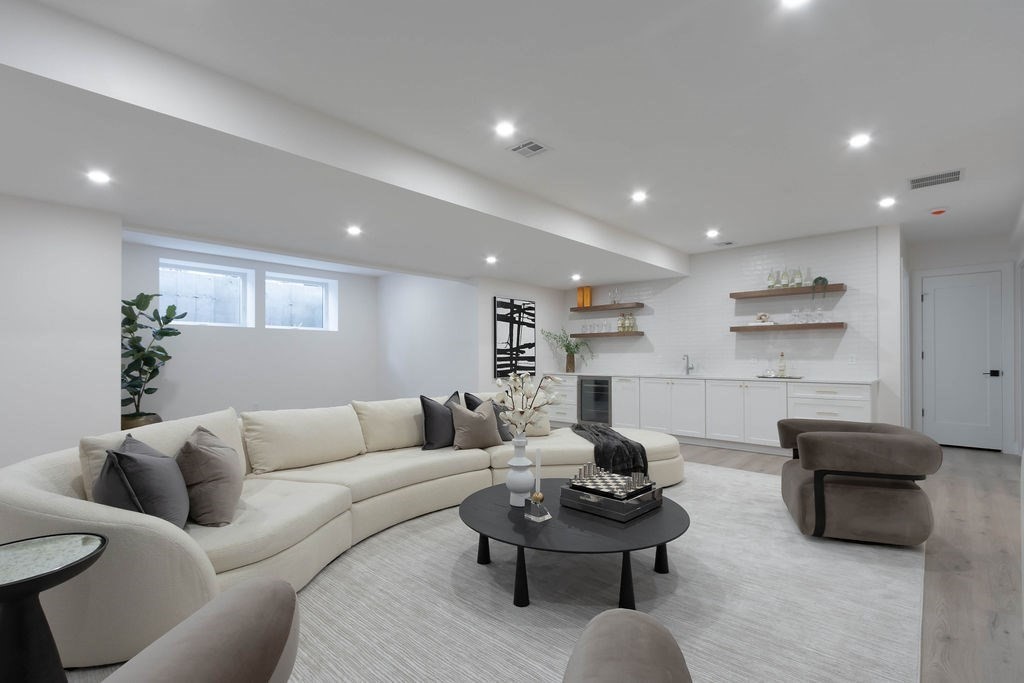 65 Mann Avenue Needham, MA 02492 - Photo 15 of 16 a living room with furniture and a potted plant
