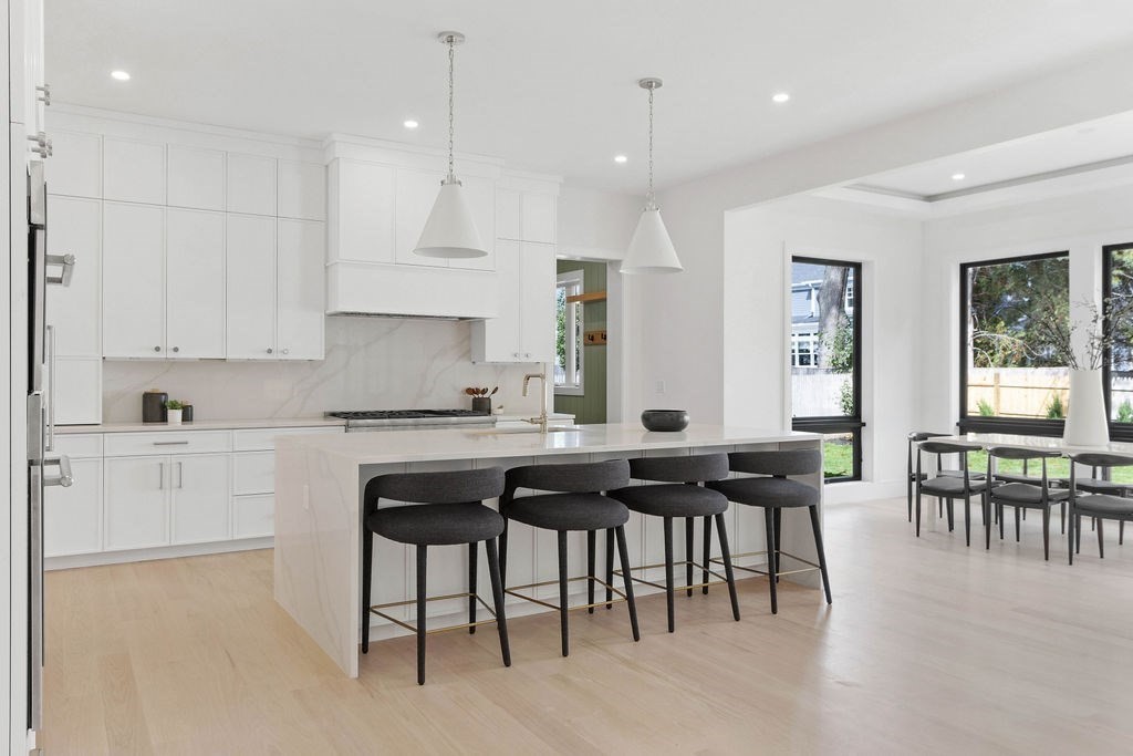 65 Mann Avenue Needham, MA 02492 - Photo 3 of 16 a kitchen with cabinets table and chairs