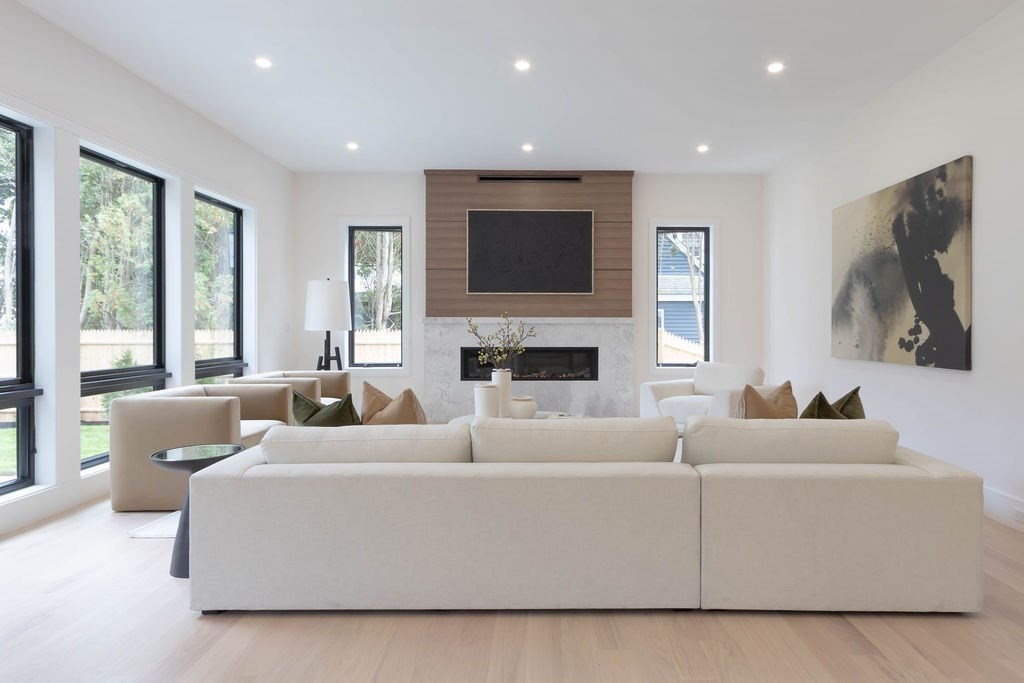 65 Mann Avenue Needham, MA 02492 - Photo 4 of 16 a living room with furniture fireplace and a flat screen tv