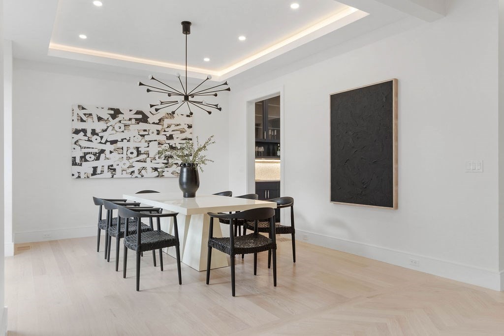 65 Mann Avenue Needham, MA 02492 - Photo 5 of 16 a view of a dining room with furniture and chandelier
