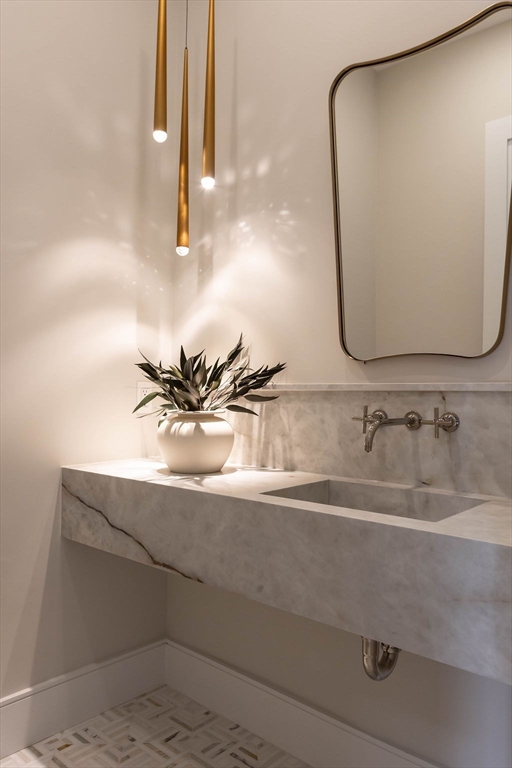 65 Mann Avenue Needham, MA 02492 - Photo 7 of 16 a bathroom with a sink and mirror