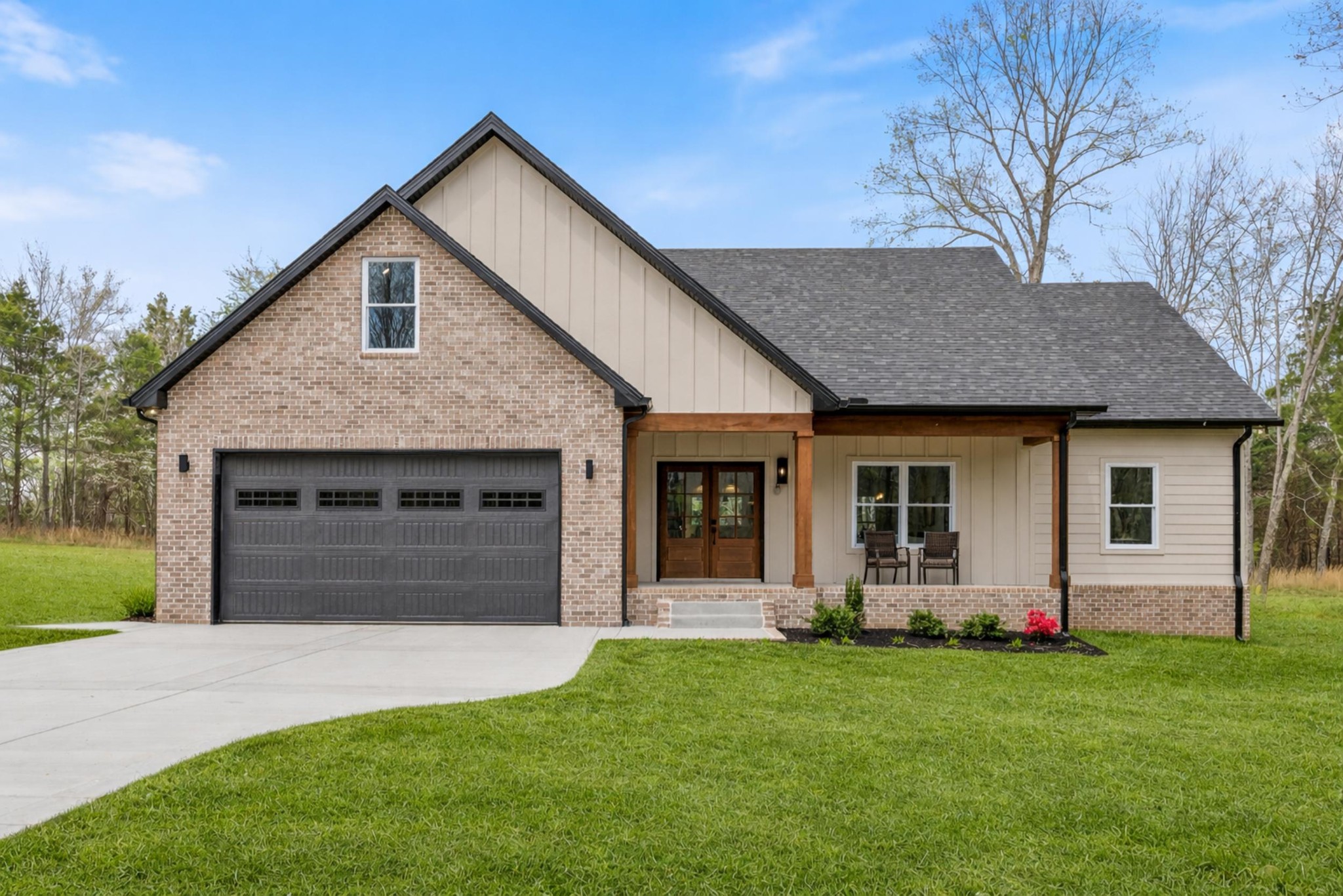a front view of house with yard and green space