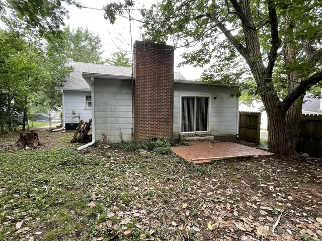a backyard of a house with lots of green space