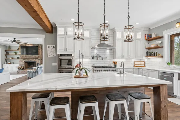a kitchen with a sink cabinets and window
