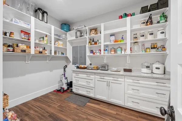 a kitchen with a table and chairs in it