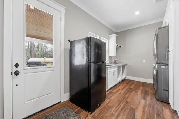 a bathroom with a granite countertop toilet sink and mirror