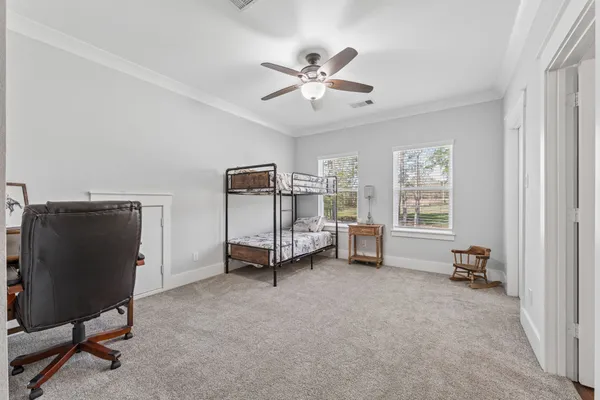 a bed room with a bed and a window