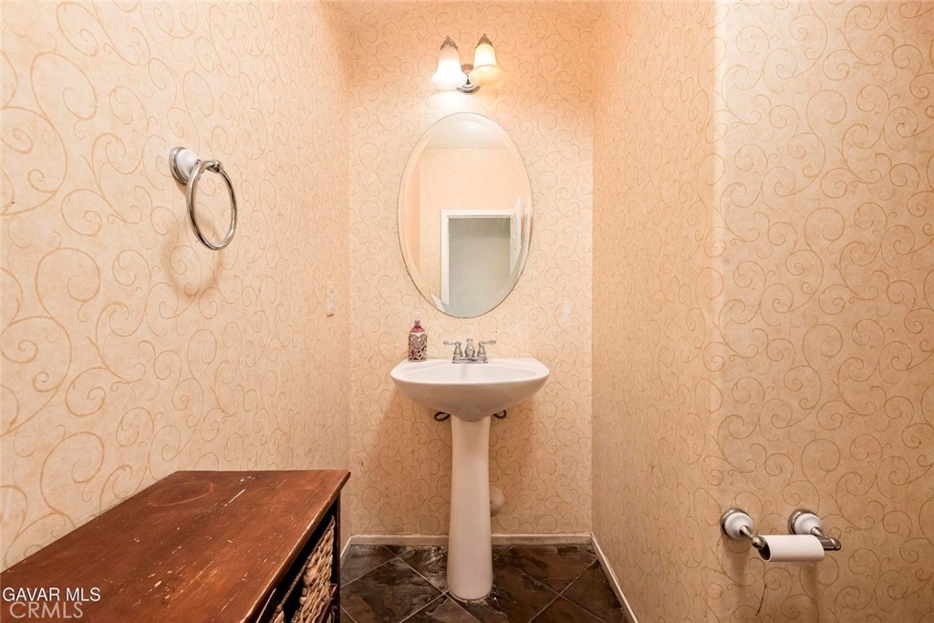 2158 Cypress Street Lancaster, CA 93535 - Photo 21 of 28 a bathroom with a sink and a mirror