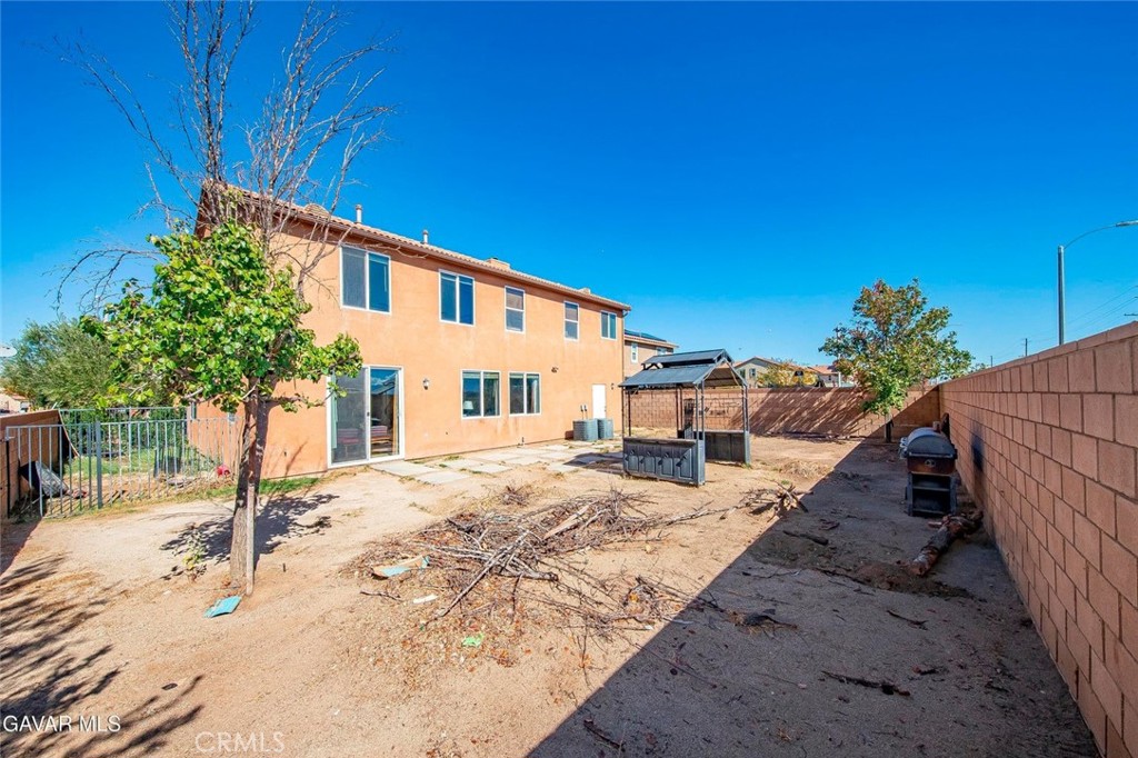 2158 Cypress Street Lancaster, CA 93535 - Photo 23 of 28 a view of a house with wooden fence