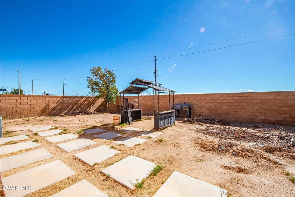 2158 Cypress Street Lancaster, CA 93535 - Photo 25 of 28 a view of a swimming pool with a lounge chair