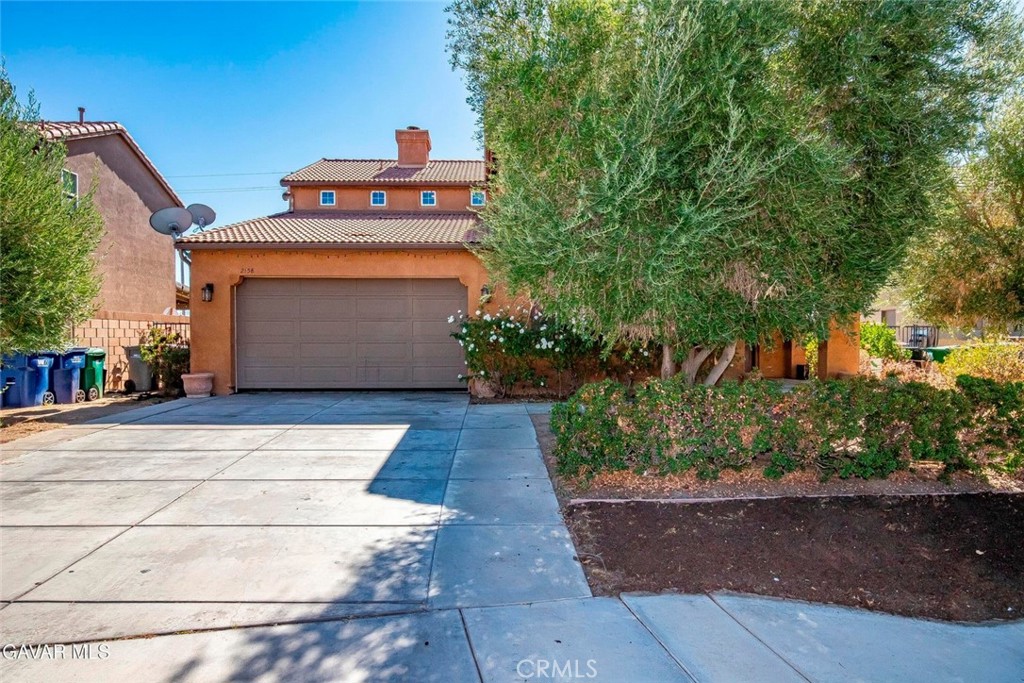 2158 Cypress Street Lancaster, CA 93535 - Photo 27 of 28 a view of a house with a yard