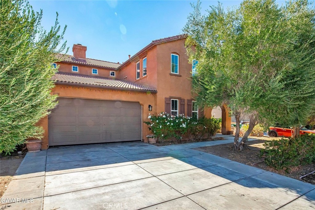 2158 Cypress Street Lancaster, CA 93535 - Photo 28 of 28 a front view of a house with garden