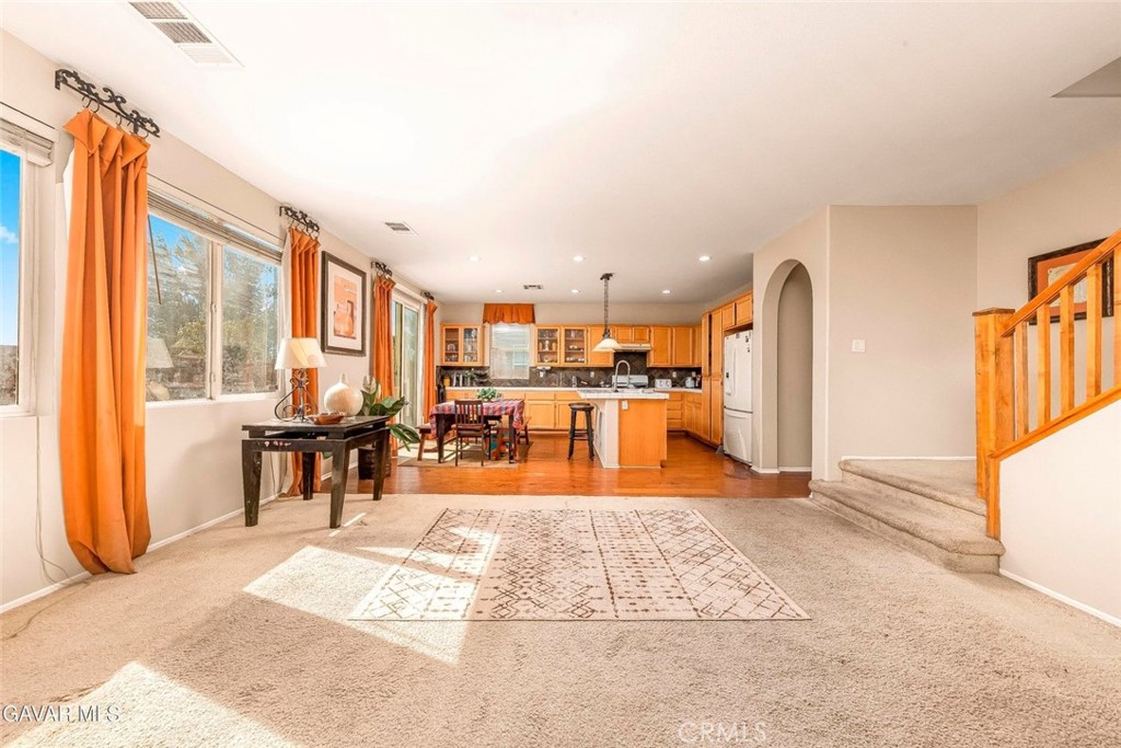 2158 Cypress Street Lancaster, CA 93535 - Photo 8 of 28 a view of a living room filled with furniture and a table