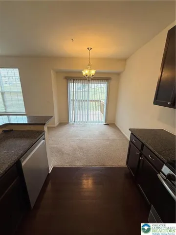 a spacious bedroom with a bed and a window