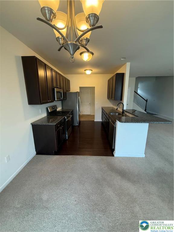 5335 Jutland Road Allentown, PA 18104 - Photo 13 of 28 a kitchen with kitchen island a counter top space appliances and a ceiling fan