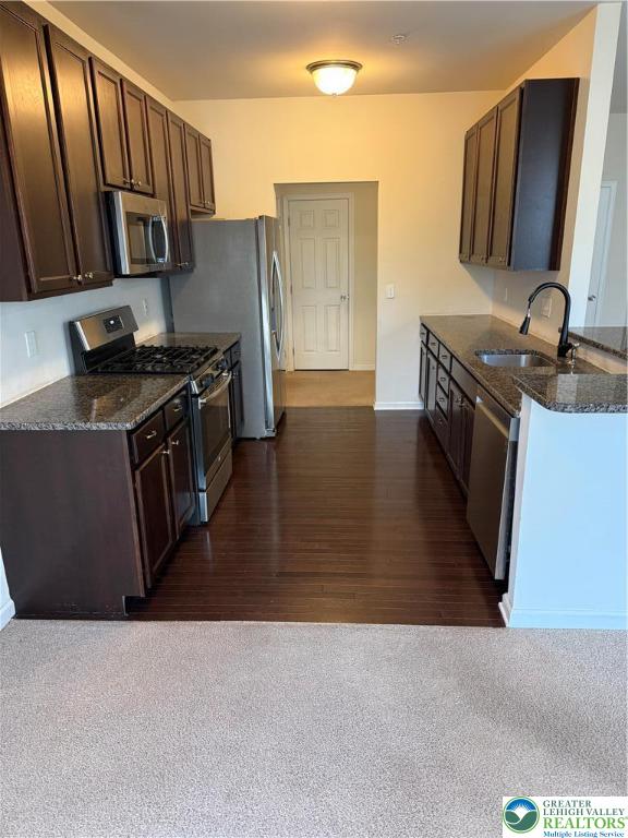 5335 Jutland Road Allentown, PA 18104 - Photo 15 of 28 a kitchen with stainless steel appliances granite countertop a stove a sink and a refrigerator