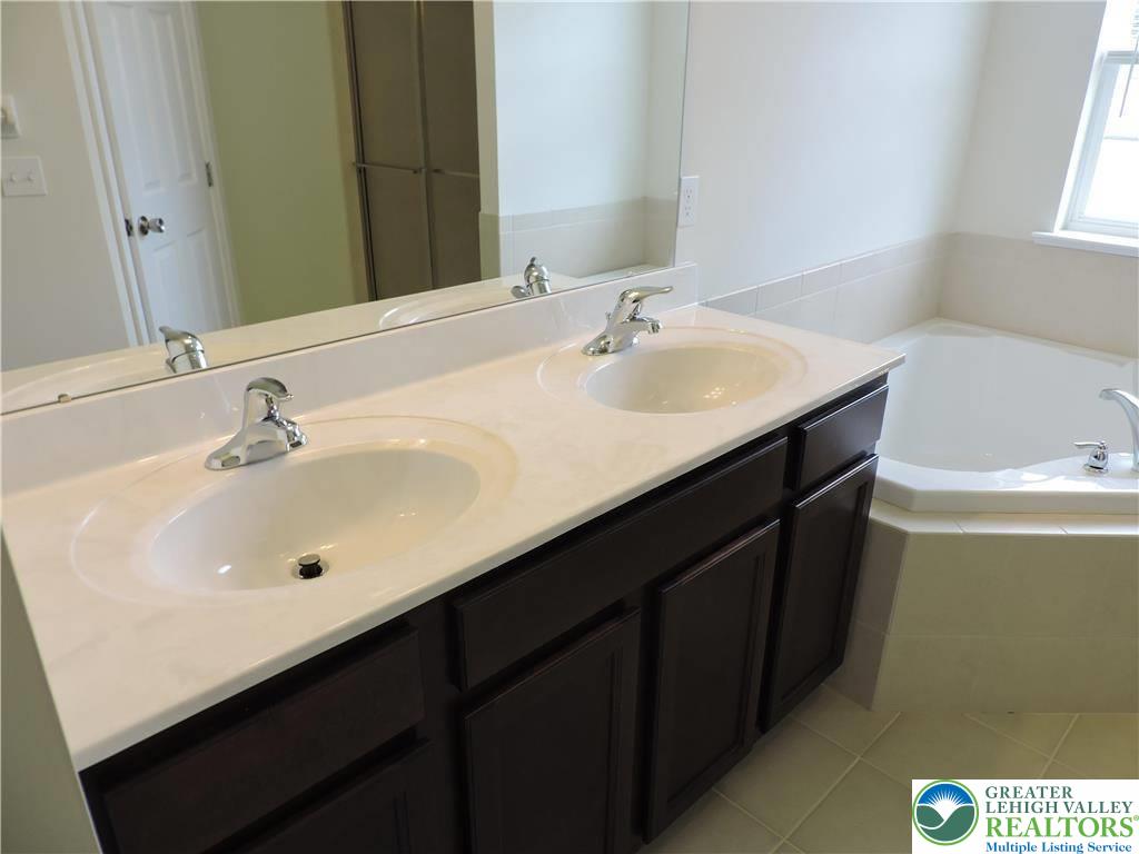 5335 Jutland Road Allentown, PA 18104 - Photo 18 of 28 a bathroom with a sink and a mirror