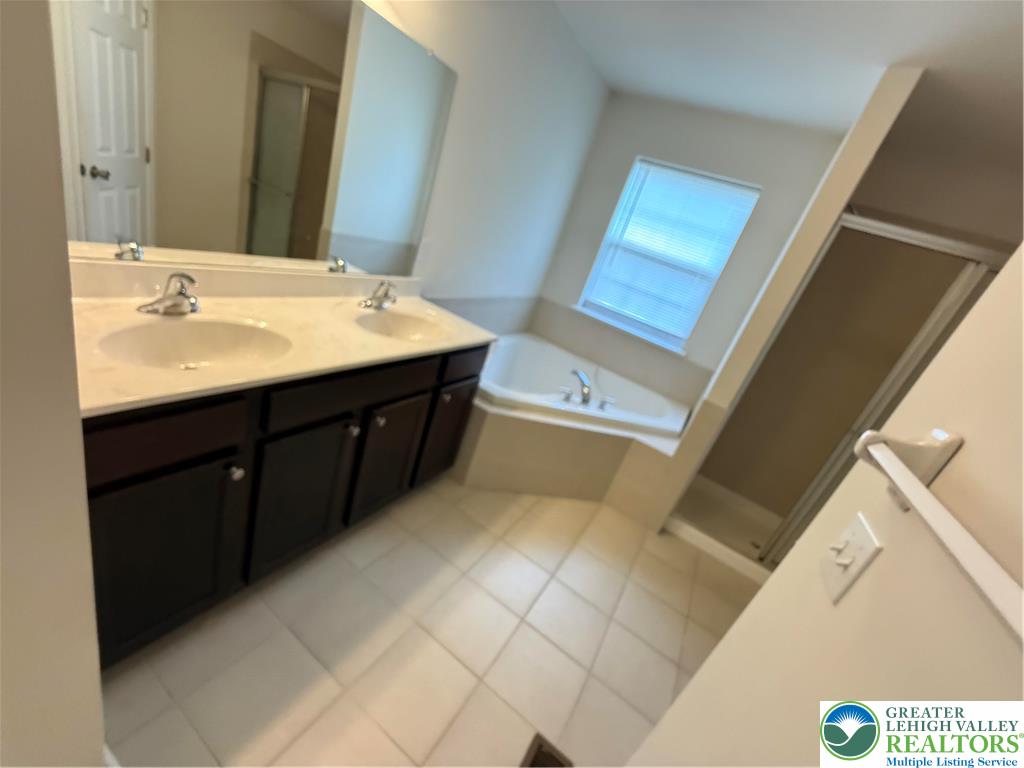 5335 Jutland Road Allentown, PA 18104 - Photo 21 of 28 a bathroom with a sink vanity and mirror