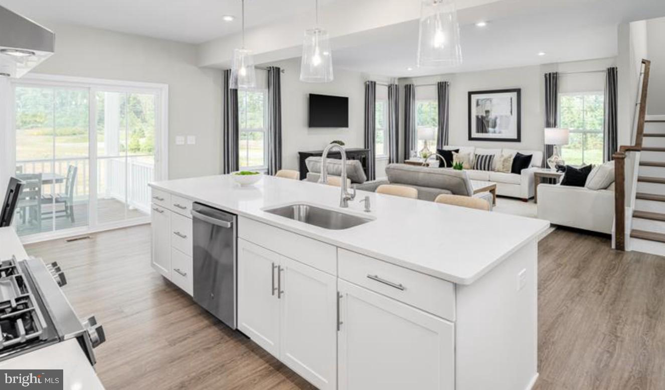 1410 Leeland Forest Road, Unit 25 Upper Marlboro, MD 20774 - Photo 6 of 21 a view of living room kitchen with furniture and flat screen tv
