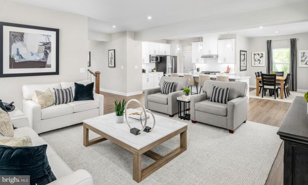 1410 Leeland Forest Road, Unit 25 Upper Marlboro, MD 20774 - Photo 7 of 21 a living room with furniture and kitchen view