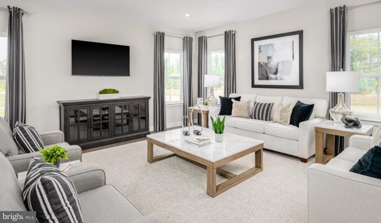 1410 Leeland Forest Road, Unit 25 Upper Marlboro, MD 20774 - Photo 8 of 21 a living room with furniture a flat screen tv and a fireplace