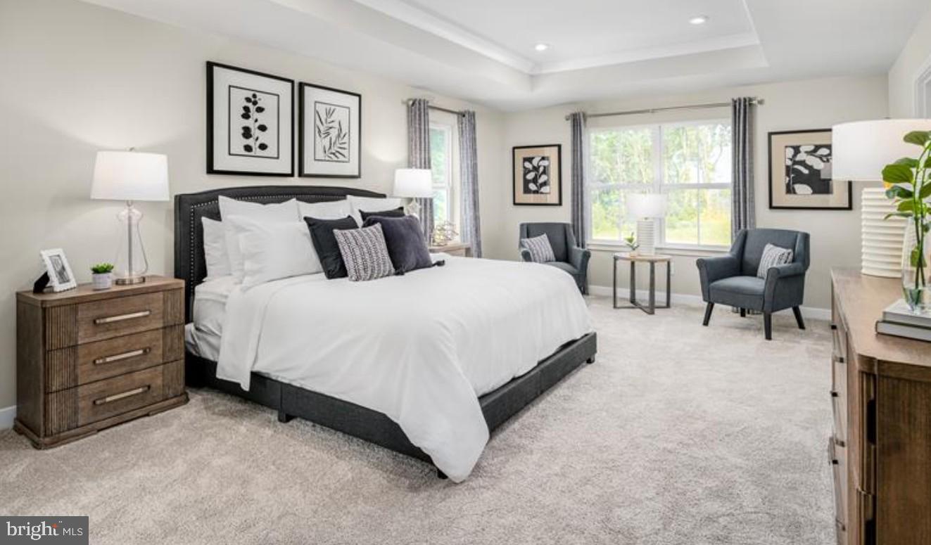 1410 Leeland Forest Road, Unit 25 Upper Marlboro, MD 20774 - Photo 10 of 21 a spacious bedroom with a bed and furniture