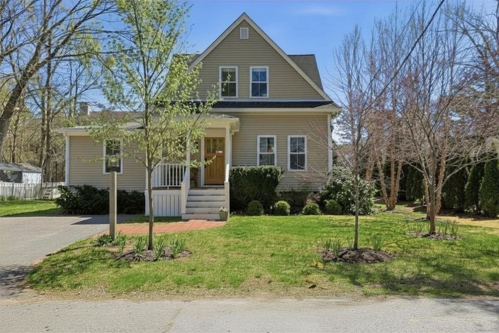 69 Potter Street Concord, MA 01742 - Photo 1 of 31 a front view of a house with a yard