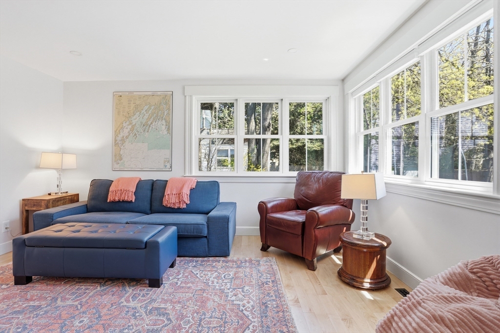 69 Potter Street Concord, MA 01742 - Photo 12 of 31 a living room with furniture and large windows