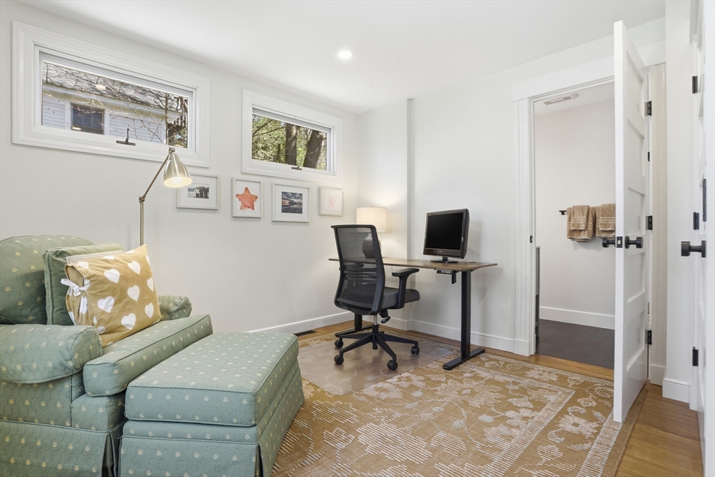 69 Potter Street Concord, MA 01742 - Photo 15 of 31 a work room with furniture and a flat screen tv