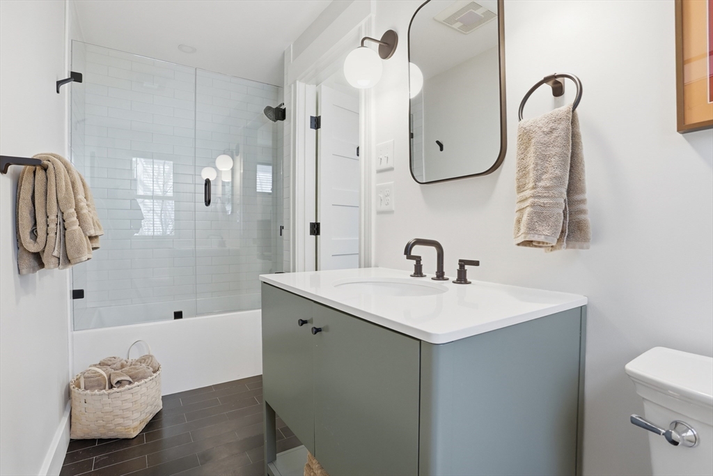69 Potter Street Concord, MA 01742 - Photo 16 of 31 a bathroom with a sink and mirror with toilet