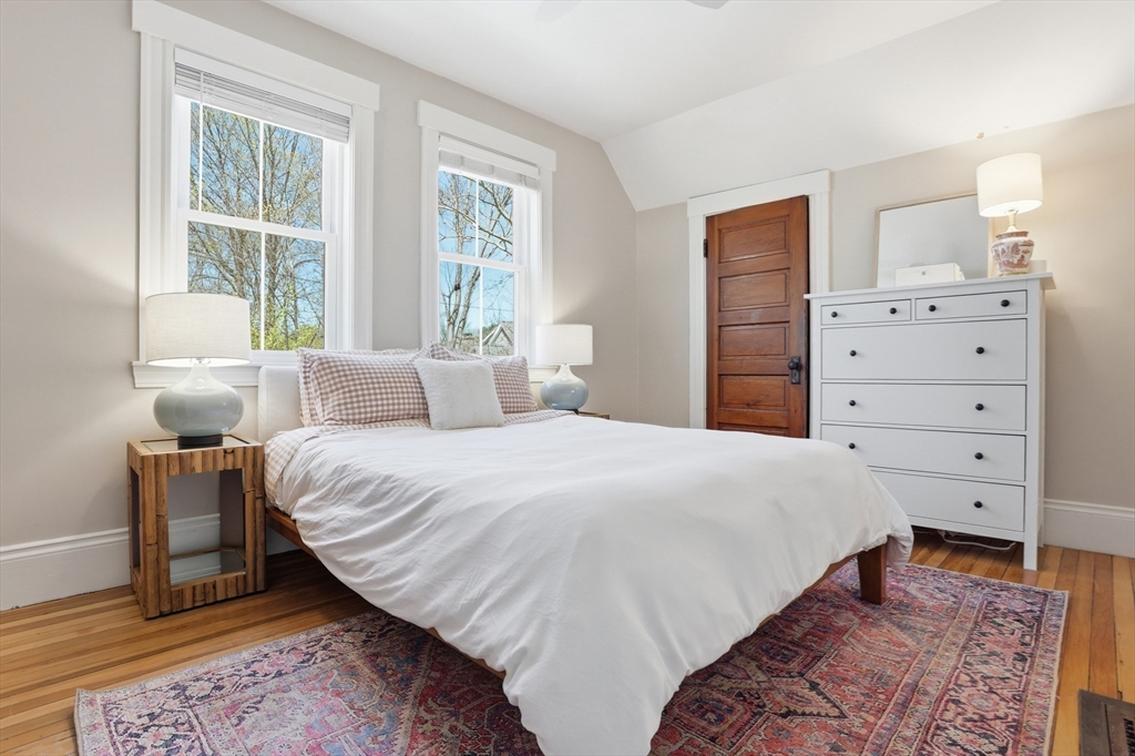 69 Potter Street Concord, MA 01742 - Photo 19 of 31 a bedroom with a bed and a dresser