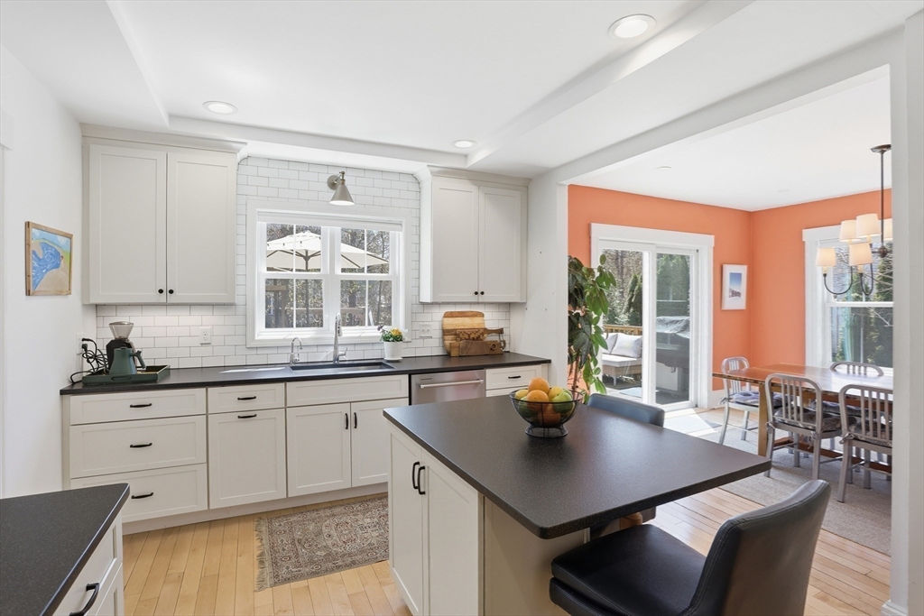 69 Potter Street Concord, MA 01742 - Photo 2 of 31 a kitchen with a sink stove and cabinets