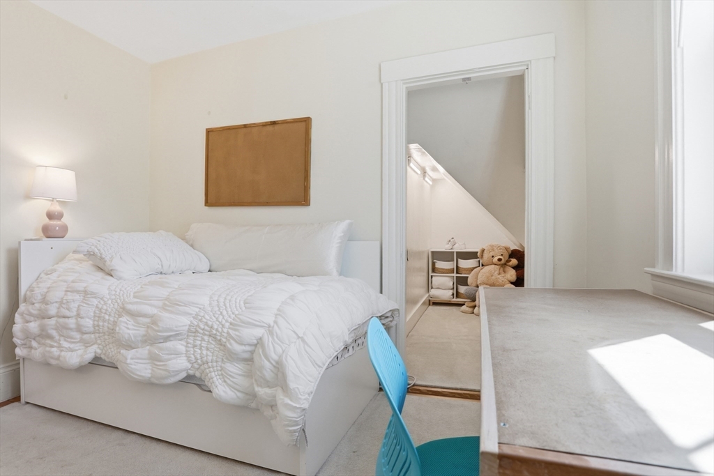 69 Potter Street Concord, MA 01742 - Photo 21 of 31 a bedroom with a bed and a couch