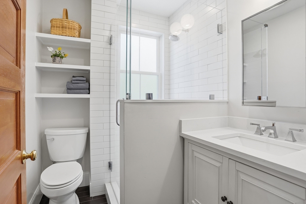 69 Potter Street Concord, MA 01742 - Photo 22 of 31 a bathroom with a toilet sink and mirror