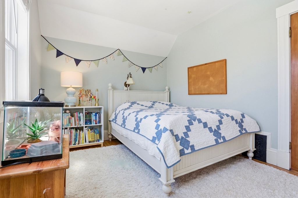 69 Potter Street Concord, MA 01742 - Photo 25 of 31 a bed sitting in a bedroom next to a window