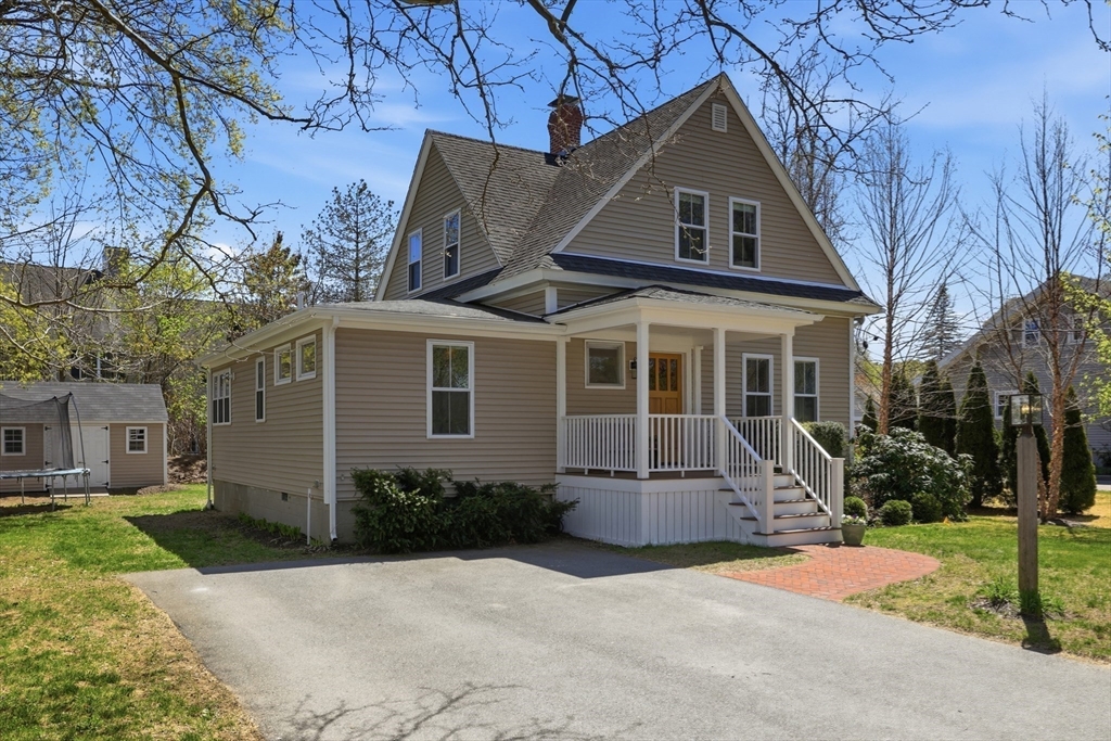 69 Potter Street Concord, MA 01742 - Photo 30 of 31 a front view of a house with a yard