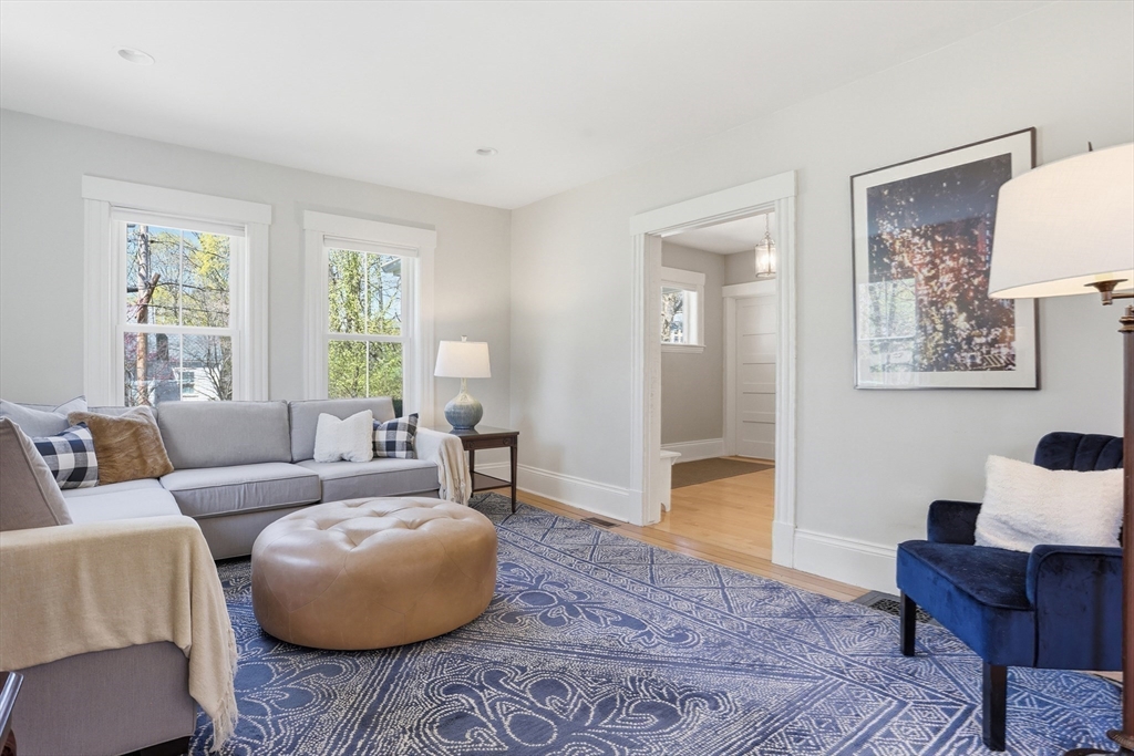 69 Potter Street Concord, MA 01742 - Photo 8 of 31 a living room with furniture and a large window